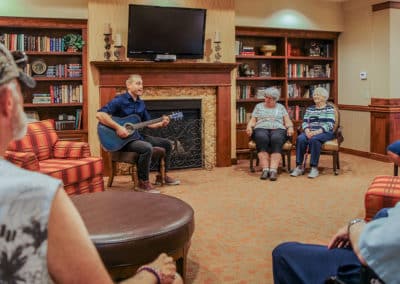 residents listening to music in library