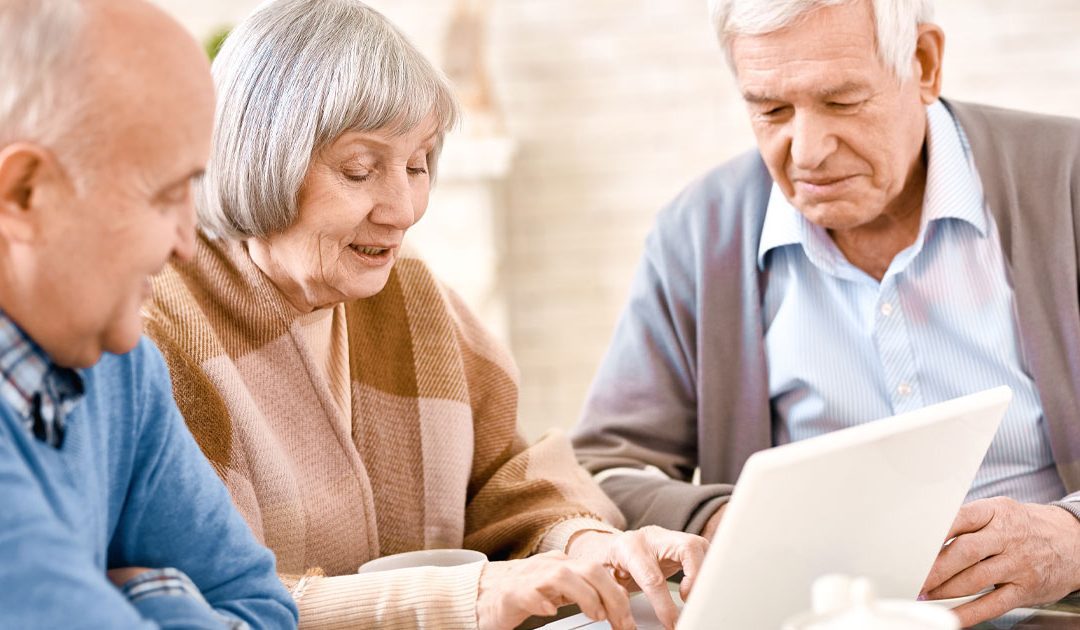 Elderly people searching the internet for affordable senior care