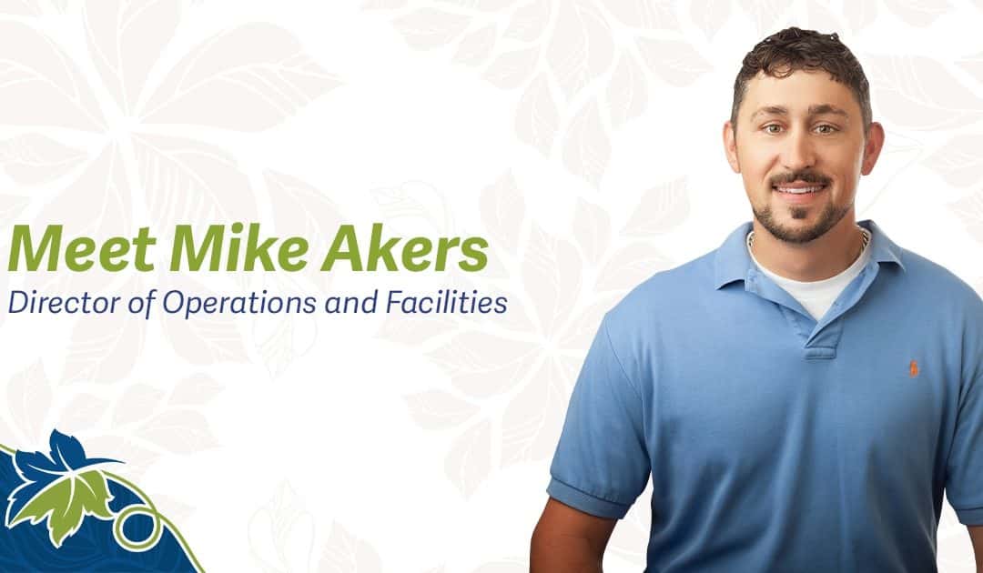 mike akers headshot in blue polo shirt