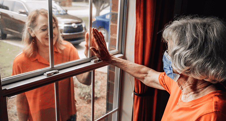 window visit with elderly woman and loved one
