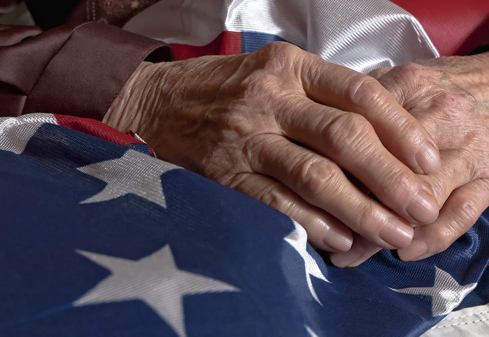 Close up of hands holding the American flag